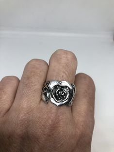 Lovely and delicate Rose flower ring 925 Sterling silver with black rhodium Size 8 or 8.75 can be re sized for you on request. My jeweler charges $10 All rings are shipped in a nice gift box. Check out our over a THOUSAND great reviews Engraving is $4 per letter and is not always perfect depending on the piece. It can take a few days if the jeweler is busy. This is payable to Paypal Judithsltd@gmail.com Silver Rose Design Ring, Silver Flower Ring With Rose Design, Silver Ring With Rose Design, Silver Rose Design Jewelry For Promise Ring, Elegant Silver Rings With Rose Details, Silver Flower-shaped Rings With Rose Design, Silver Jewelry With Roses For Gift, Silver Rose Ring Jewelry, Silver Rings With Rose Design