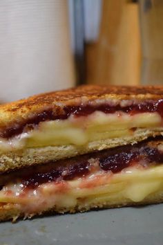 a grilled cheese and jelly sandwich on a plate