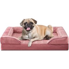 a pug dog laying on top of a pink pet bed with its tongue hanging out