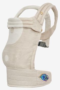 the back side of a baby carrier with an eye patch on it's chest