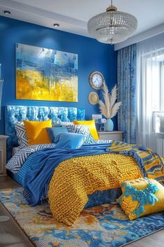 a bedroom with blue walls, yellow and white bedding and artwork on the wall