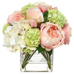 a vase filled with pink and green flowers