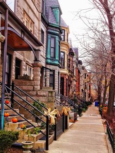 a row of houses with stairs leading up to them