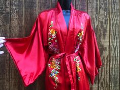 "Vintage floral embroidered robe. Open front. Tie belt around waist. Condition: good. ✂Measurements TAKEN ACROSS FRONT LAID FLAT✂ shoulders: 24\" waist: 24\" length: 50\"" Fitted Long Robe For Spring, Long Floral Embroidered Kimono For Wedding, Spring Wedding Embroidered Kimono, Spring Wedding Kimono With Floral Embroidery, Wedding Kimono With Floral Embroidery, Spring Long Embroidered Robe, Embroidered Long Sleeve Robe For Loungewear, Spring Embroidered Long Robe, Vintage Kimono With Floral Embroidery