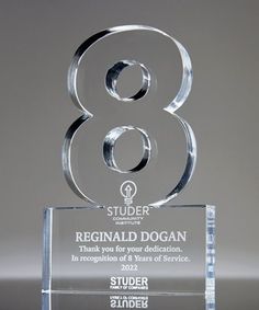 a glass award with the number eight on it