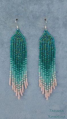 These handmade earrings are made of high-quality Czech beads and strong synthetic thread. They are elegant, fashionable, and highly versatile, suitable for everyday wear. Color: green,mint ,herbal. There may be some color discrepancies which is due to the different monitor settings 100% hand made with love! Measurements: Length-about 11cm (4.33 inch) Width -about 2 cm (0.79 inch) Materials: Sterling silver components Czech glass beads Strong bead weaving thread Green Fringe Beaded Drop Earrings, Green Tassel Drop Earrings With Dangling Beads, Green Tassel Beaded Drop Earrings, Green Tasseled Beaded Drop Earrings, Green Beaded Drop Tassel Earrings, Green Fringe Round Bead Earrings, Green Tassel Dangle Chandelier Earrings, Green Tassel Chandelier Dangle Earrings, Green Fringe Drop Earrings