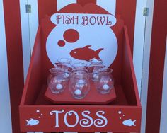 there is a red box with glasses in it that says, fish bowl tossers