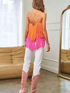 Get ready to shine with this I am the Light in my Life Fringe Overlay Cami Top. With a playful fringe overlay that adds movement and texture, this cami top is perfect for parties and events. The cross straps add a stylish touch, while the flattering silhouette will keep you feeling confident all night long. Color: Orange/Pink or Yellow/Green Fabric: 100% Polyester Brand: Davi & Dani Includes: x1 Top Sizes: S-XL, Regular Sizing Length: 13" - 14.5" Model is 5'9" and wearing size small (32-24-34) Spring Festival Tops With Beaded Fringe, Spring Fitted Tops With Beaded Fringe, Spring Fitted Top With Beaded Fringe, Spring Sleeveless Top With Beaded Fringe, Summer Party Tops With Tassels, Summer Sleeveless Tops With Beaded Fringe, Spring Party Tops With Beaded Fringe, Pink Fringed Top For Spring, Pink Fringe Top For Spring