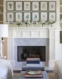 a living room filled with furniture and a fire place in front of a white fireplace