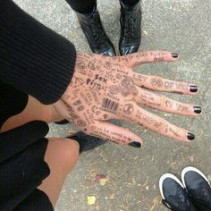 a person's hand with writing on it