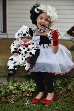 two children dressed up in dalmatian costumes