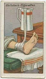 a card with an image of a person's foot on a bed