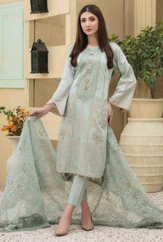 It is a beautiful semi formal dress for women. It is available in large size only. Chest 45 inches all around, waist 43, hips 47 and length 44 inches. It is a beautiful lawn jacquard (banarsi) kameez with embroidered neckline. It comes with heavy organza embroidered, mirror, cut work dupatta and plain pants. It is a tawakkle branded suit. Fabric lawn jacquard. Color ice blue . No return or exchange please . Models picture is just for reference only. Semi Formal Dress For Women, Formal Dress For Women, Salwar Kameez Pakistani, Designer Salwar Kameez, Pakistani Salwar, Plain Pants, Designer Salwar, Pakistani Salwar Kameez, Semi Formal Dress