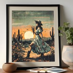 a painting of a woman in a dress and cowboy hat walking through the desert at sunset