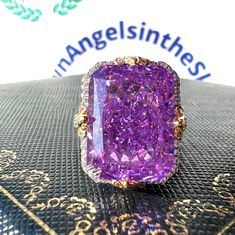 10 Carat Amethyst Ring Classic Rectangular Ring 10*14 mm Violet Amethyst Simulant Anniversary Statement Ring S925/ 14K /18K Gold Main stone is 10*14mm near 8 Carat with side stone 2 Carat Total 10 Carat ♥ 5 days ready to ship ♥ 925 SILVER WITH 18KGP ♥ The main stone is the finest Simulated Amethyst. ♥ Absolutely gorgeous and beautifully handcrafted Simulated Amethyst Jewelry Set. ♥ This classic yet trendy Jewelry Set makes the perfect Christmas/Anniversary/Valentine's/Birthday gift for her that Luxury Rectangular Amethyst Ring As A Gift, Formal Purple Rings With Rectangular Stone, Purple Amethyst Ring With Rectangular Stone For Anniversary, Formal Purple Amethyst Ring With Rectangular Shape, Amethyst Ring With Rectangular Purple Stone For Anniversary, Rectangular Purple Amethyst Ring With Accent Stones, Rectangular Purple Rings With Accent Stones, Luxury Purple Rings For Gift, Formal Rectangular Amethyst Ring