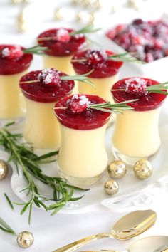 small desserts with cranberry sauce and rosemary garnish on a white plate