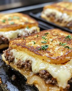 some food that is sitting on top of a grilling pan with cheese and meat