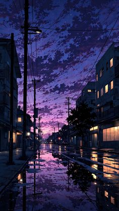 an image of a city street at night with the sun setting in the sky and clouds reflecting on the wet pavement