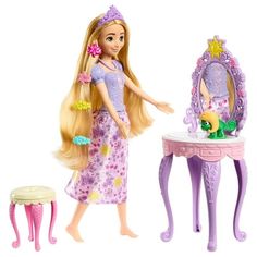 a barbie doll standing next to a table with a mirror and stool