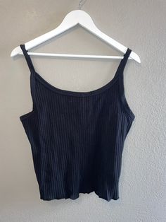 "Black ribbed tank top  Great Condition Measurements Bust 36-38\"  Length 20.5\"  Cotton/spandex" Black Ribbed Scoop Neck Tank Top, Fitted Black Ribbed Vest, Stretch Ribbed Scoop Neck Vest, Fitted Black Camisole Top, Black Ribbed Sleeveless Camisole, Black Fitted Tank Top, Casual Ribbed Vest With Tank Straps, Trendy Ribbed Tank Top With Spaghetti Straps, Trendy Ribbed Spaghetti Strap Tank Top