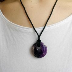 "A beautiful polished Amethyst semi-precious gemstone donut shaped pendant necklace.  Carved and finished in classic style that is simple and goes with anything.  The Amethyst pendant is hung on black threaded cord with an adjustable clasp so the length can be set to the length that suits you.  Adjusts from 9.5\" (24cm) to 11.5\" (29cm) The pendant measures 1 1/4\" (3cm) in diameter.  Suitable for Men and Women with its elegant but simple style.  Each item is made using natural crystal, and so e Black Thread Necklace, Donut Pendant, Thread Necklace, Donut Shape, Les Chakras, Round Necklace, Black Thread, Necklace Gemstone, Wedding Jewellery Necklace