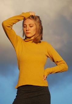 Organic Cotton Thermal Loose Turtle Neck in Mustard Yellow - Organic Clothing - Long Sleeve Top I made this super soft loose turtle neck top with a USA grown organic cotton thermal in a lovely honey mustard color. It features a double loos turtle neck and extra long sleeves with a banded cuff.Designed to hit at the hip and perfect for tucking into high-waisted pants. The organic cotton is grown and manufactured in the US which makes it more costly than imported fabrics , but the quality is pheno Relaxed Fit Turtleneck Tops, Winter High Neck Tops With Relaxed Fit, Winter Chic Ribbed Funnel Neck Tops, Yellow Top For Layering In Fall, Stretch Cotton Funnel Neck Tops, Cozy Fit High Neck Top For Fall, Solid Color Funnel Neck Top With Relaxed Fit, Solid Turtleneck Top With Relaxed Fit, High Neck Cotton Top For Winter