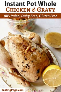 the instant pot whole chicken and gravy recipe on a plate with lemons