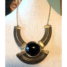 "7 Charming Sisters Black & Gold Bib Necklace. A beautiful statement necklace that can go far! There are three pieces on a gold-tone chain, with a lobster claw clasp, textured pieces and black cabachon in its center. Measurements: Length: 14\"; Pendant: Height: 2\", Width: 2\"; Pendant Total Height: 2.5\"; Extender: 3\"; Necklace Total Length: 14\"+2.5\"+3\"=19.5\"." Metal Bib Necklace As Costume Jewelry Gift, Metal Bib Necklace For Costume Jewelry Gift, Sisters Black, Gold Bib Necklace, Buddha Beads, Beaded Jewelry Necklaces, Obsidian Stone, Circle Necklace, Bib Necklace