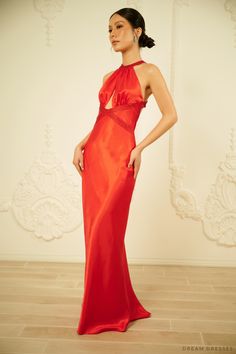 Feel glam and luxurious adorned in our Lucia red silk evening dress with halter neck detailing. Ideal for a rehearsal dinner, make a bold entrance in this stunning gown. Lucia features a cut-out detailing in the front and open back adding a sultry flair while keeping the overall look sophisticated and classy. Beading work along the neckline and waist add a subtle sparkle and shine. The dress: Color: red Neckline: halter neck with cut-out Back: open back with straps Details: beadings on neckline Dress With Halter Neck, Silk Evening Dress, Look Sophisticated, Dream Dresses, Red Gowns, Stunning Gowns, Red Silk, Rehearsal Dinner, Dream Dress