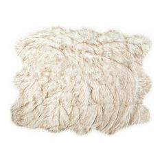 a white sheepskin rug on a white background