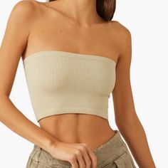 Brand New.. So Classic Tube-Style Bandeau Top Featured In A Cropped Design With Ribbed Fabrication And A Stretch Fit. Pull-On Style. This Item Is Listed As Nwt As It Was Bought From A Wholesaler And Does Not Have Tags As They Were Never Put On The Garment. Trendy Beige Crop Top With Built-in Bra, Seamless Cropped Beige Top, Beige Seamless Crop Top, Chic Stretch Beige Tube Top, Seamless Strapless Crop Top, Beige Stretch Tube Top For Summer, Chic Beige Stretch Tube Top, Beige Seamless Tube Top, Beige Bandeau Crop Top For Summer