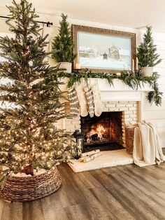 a decorated christmas tree sitting in front of a fireplace