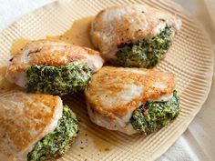 three pastries with broccoli and cheese on a plate