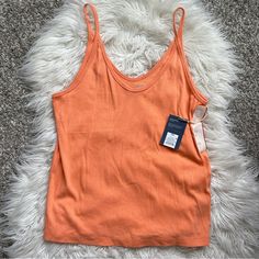 This Is So Soft And Stretchy! I Bought And Forgot About It And It No Longer Fits. Brand New! Orange Ribbed Sleeveless Top, Ribbed Cotton Cami Top, Trendy Orange Seamless Top, Casual Orange Seamless Tops, Casual Orange Ribbed Top, Orange Ribbed Tops For Spring, Casual Cami Top In Solid Color, Orange Ribbed Summer Tops, Casual Cotton Seamless Tops