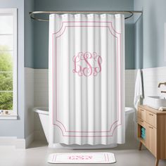 a monogrammed shower curtain with the letter w in pink