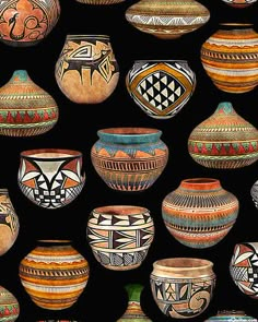 many different vases with designs on them are lined up in rows against a black background