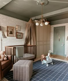 a baby's room with a crib, rocking chair and teddy bear on the rug