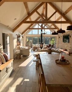 a living room filled with furniture and a fire place in the middle of a room