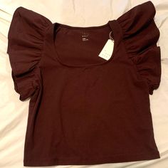 Brown Top From A New Day, Double Flutter Sleeves, Slim Fit Blouse, Never Worn, Still Has A Tag, Great Condition. Length: 18 1/4 Chest: 16 Casual Cotton Tops With Butterfly Sleeves, Casual Cotton Top With Butterfly Sleeves, Brown Washed Short Sleeve Tops, Cheap Brown Soft-washed Tops, Brown Sleeveless Top With Built-in Bra, Fitted Cotton T-shirt With Ruffle Sleeves, Brown Cotton V-neck Top, Brown Casual 3/4 Sleeve Top, Brown Shirt