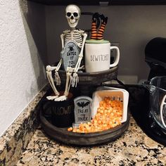 a kitchen counter topped with halloween decorations