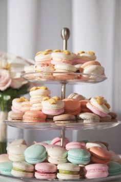 three tiered trays filled with different types of macaroons