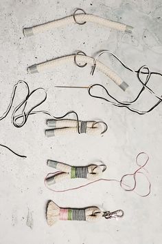 several pairs of scissors and cords laid out on the ground