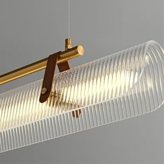 a light that is hanging from the ceiling with some wires attached to it and two lights on each side