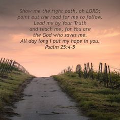 a dirt road leading into the distance with a sky in the background and a bible verse written on it