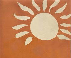 an orange and white sun painted on the side of a building