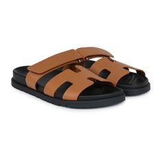 This pair of Chypre Techno sandals are in Naturel calfskin with black rubber soles and feature the iconic H and a velcro crossover strap.Origin: ItalyCondition: New and never wornAccompanied by: Hermes box, two shoe dustbags, ribbonSize: 38 EU Modern Calf Leather Slides With Rubber Sole, Modern Calf Leather Slip-on Sandals, Luxury Double Strap Calf Leather Sandals, Luxury Sandals With Leather Sole And Double Strap, Luxury Sandals With Double Strap And Leather Sole, Luxury Sandals With Double Strap And Branded Insole, Modern Calf Leather Sandals With Cushioned Footbed, Designer Calf Leather Sandals With Rubber Sole, Designer Sandals With Rubber Sole In Calf Leather