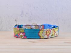 a blue dog collar with flowers on it