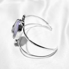 Let your lavender dreams come alive with the stunning Aria bracelet! The jade centerpiece is surrounded by swirling silver details, making for a statement piece that will look great with any outfit! Lavender jade (24x18mm) Sterling silver (925) Silver Amethyst Gemstone Cuff Bracelet, Elegant Silver Amethyst Cuff Bracelet, Lavender Jade, Silver 925, Statement Pieces, Swirl, Looks Great, Jade, Lavender