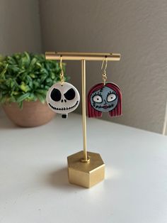 This listing is for a pair of handmade, polymer clay earrings. These are hand painted by me with liquid clay and paint.  Lots of options for this listing!  Choose:  -Jack and Sally (one of each) -Jack only -Sally only -hardware (gold or silver hooks) -nickel free hooks -measures 1.75 inches long ♥️very lightweight! Message me with any questions. Jack And Sally Clay Earrings, Nightmare Before Christmas Polymer Clay Earrings, White Fun Polymer Clay Earrings, Whimsical Hand Painted Clay Earrings, Handmade Fun Clay Earrings, Hand Painted Polymer Clay Novelty Jewelry, Fun Hand Painted Polymer Clay Earrings, Cute Hand Painted Polymer Clay Earrings, Cute Hand Painted Resin Earrings