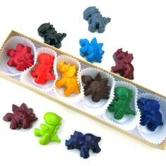 a box filled with different colored gummy bears sitting on top of each other's sides